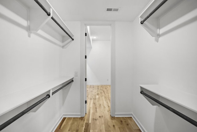 spacious closet featuring light wood-type flooring