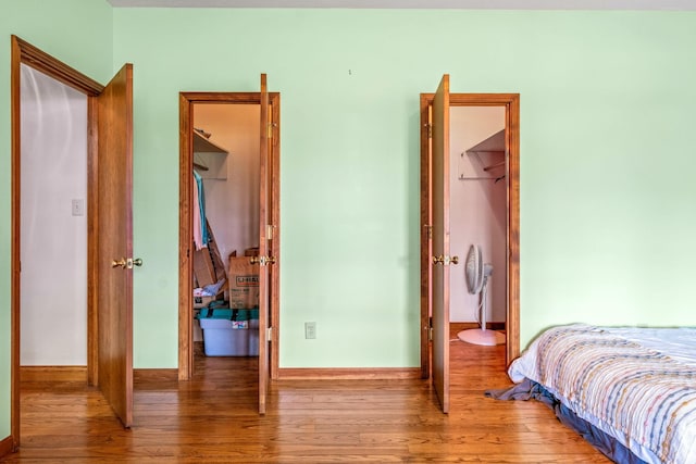 bedroom with hardwood / wood-style flooring