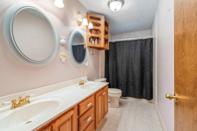 bathroom featuring toilet, vanity, tile patterned flooring, walk in shower, and a textured ceiling