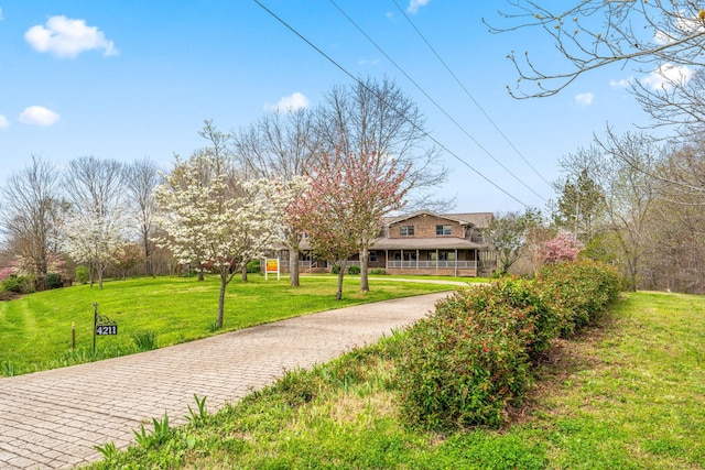 exterior space featuring a front lawn