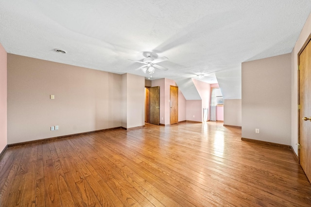 empty room featuring ceiling fan and light hardwood / wood-style flooring