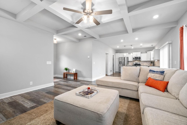 living room with ceiling fan, dark wood-type flooring, beam ceiling, and coffered ceiling