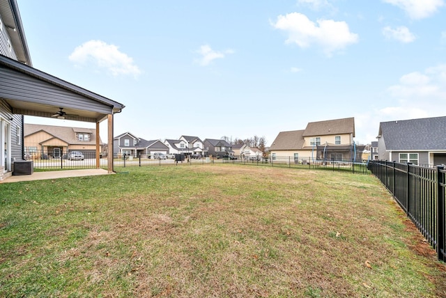 view of yard with ceiling fan