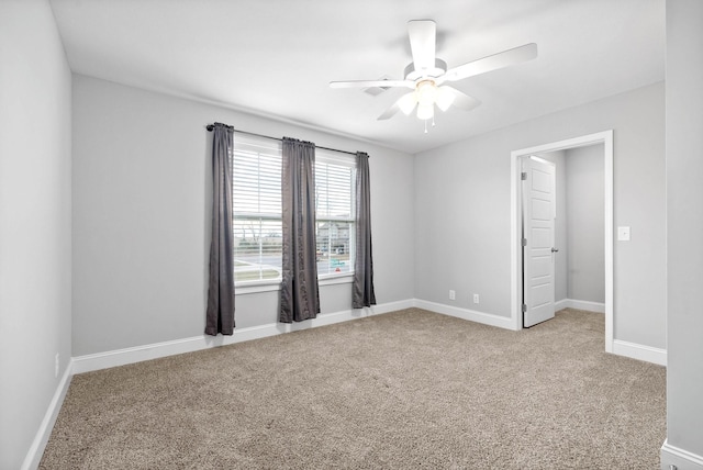 carpeted empty room with ceiling fan