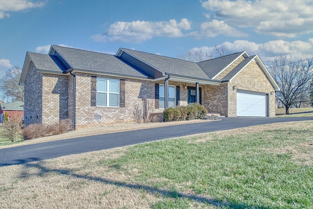 view of front facade with a front yard and a garage