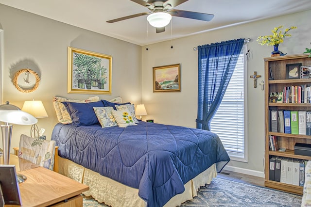 bedroom featuring ceiling fan and wood-type flooring