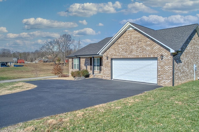 view of front facade with a garage and a front lawn