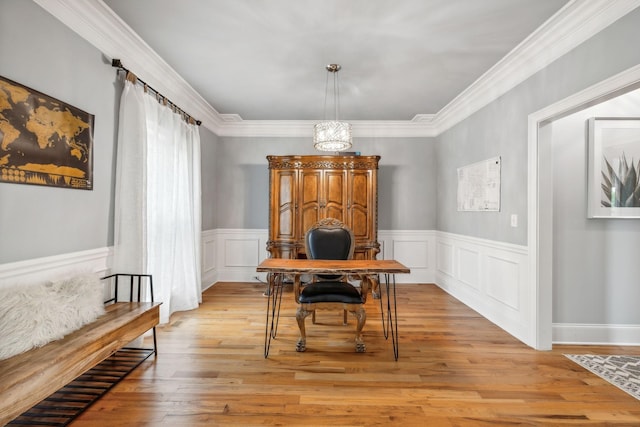 office area featuring an inviting chandelier, crown molding, and light hardwood / wood-style floors