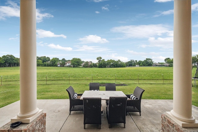 view of patio / terrace with a rural view