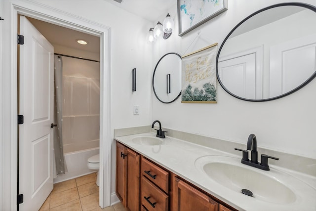 full bathroom featuring toilet, tile patterned floors, vanity, and bathtub / shower combination