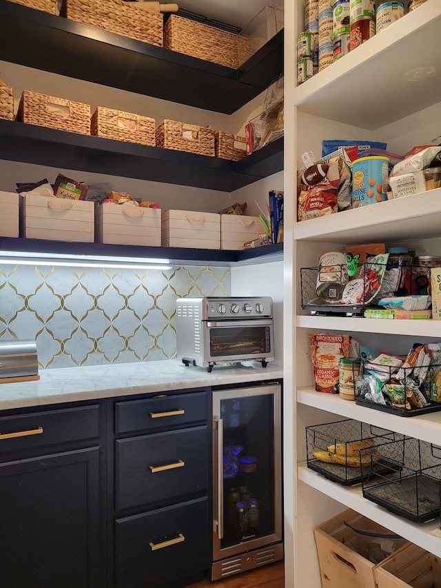 pantry with wine cooler