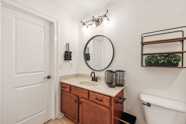 bathroom with tile patterned floors, toilet, and vanity