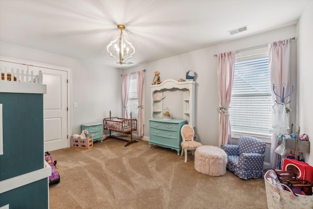 game room featuring carpet floors and an inviting chandelier