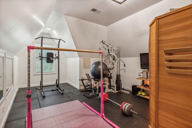 exercise area featuring vaulted ceiling