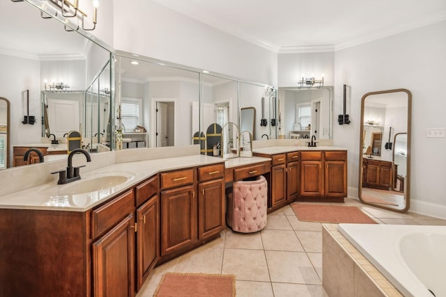 bathroom featuring tile patterned flooring, crown molding, tiled tub, and vanity