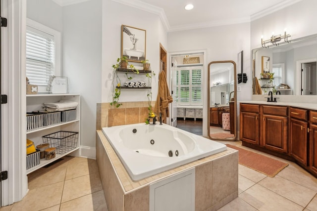 bathroom with tiled bath, vanity, ornamental molding, and tile patterned flooring