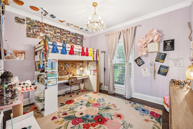 bedroom featuring built in desk, crown molding, and hardwood / wood-style flooring