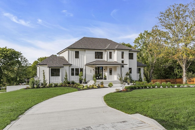 view of front of home with a front lawn and covered porch