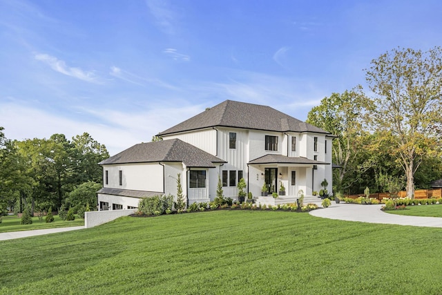 view of front of home with a front lawn and covered porch