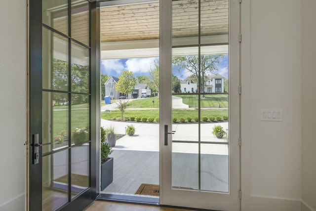 entryway featuring hardwood / wood-style floors and french doors