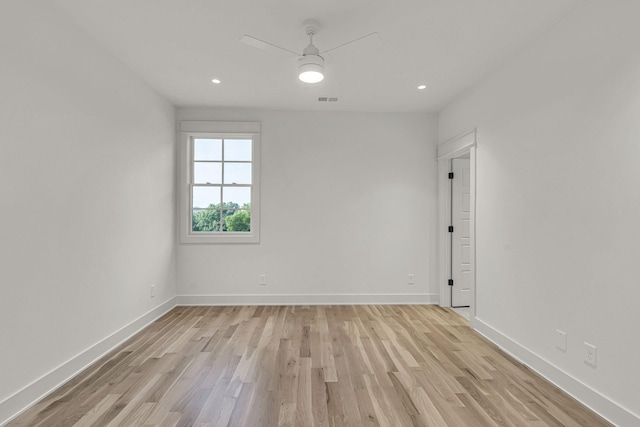 unfurnished room with ceiling fan and light hardwood / wood-style floors