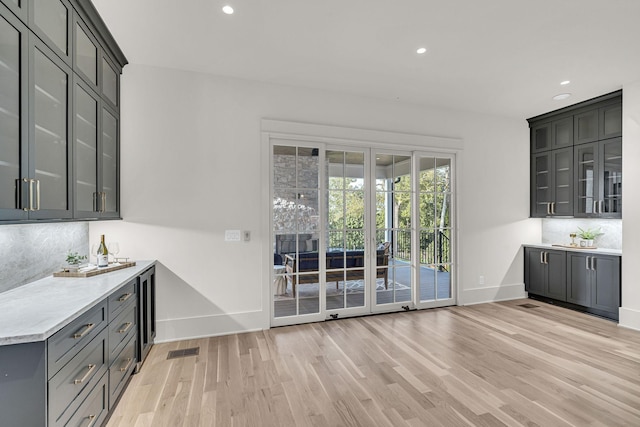 unfurnished dining area featuring light wood-type flooring