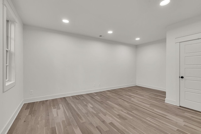 unfurnished room with light hardwood / wood-style flooring