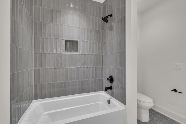 bathroom with toilet, tile patterned flooring, and shower / bathtub combination