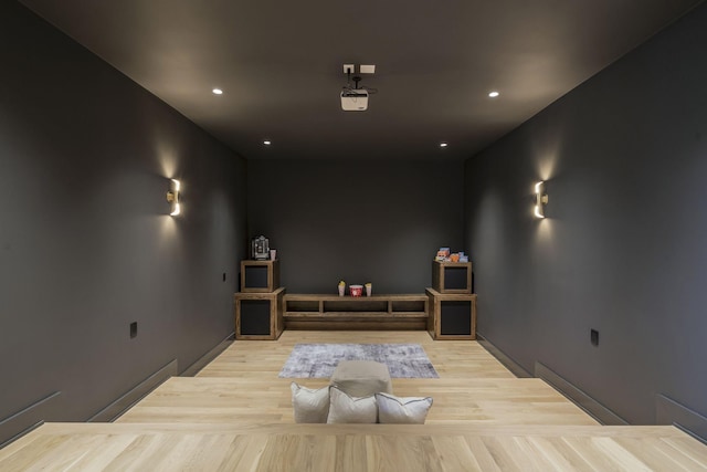 home theater with light wood-type flooring