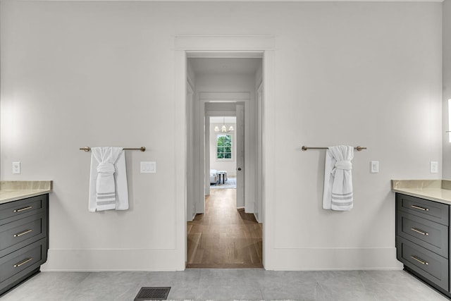 bathroom with tile patterned flooring and vanity