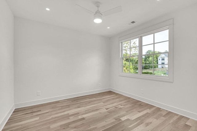 spare room featuring ceiling fan and light wood-type flooring