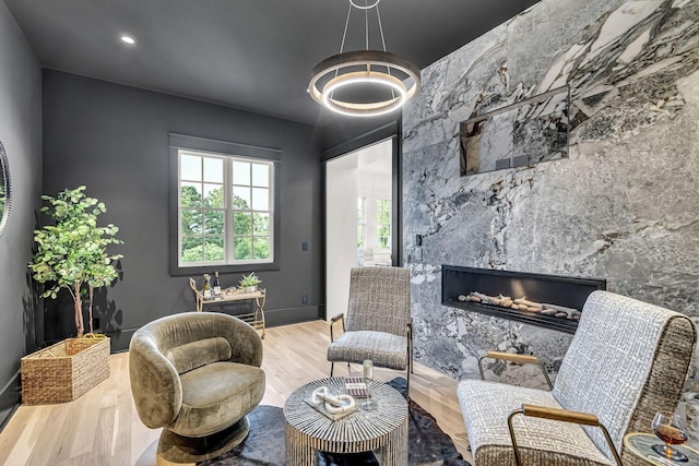 sitting room featuring light hardwood / wood-style floors