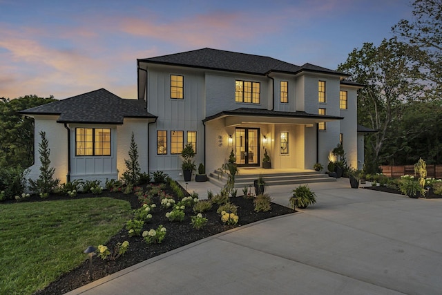 view of front of property featuring a lawn and a porch