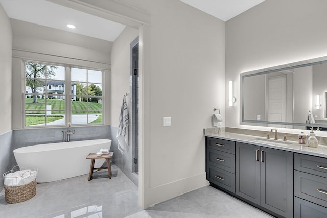 bathroom with vanity and plus walk in shower