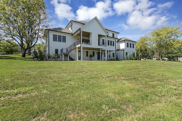 back of house with a lawn