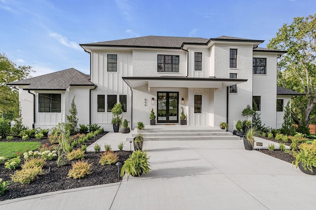 modern farmhouse with french doors and a porch