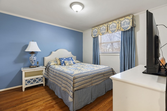 bedroom with dark wood-type flooring and crown molding