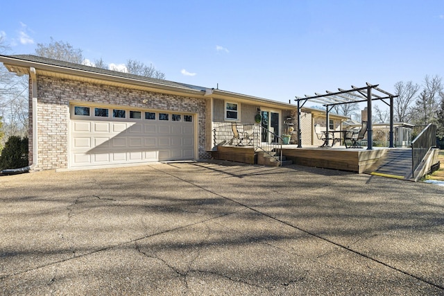 view of front of home featuring a garage and a pergola