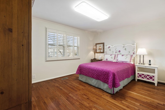 bedroom featuring dark wood-type flooring