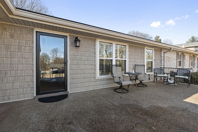 property entrance featuring a patio