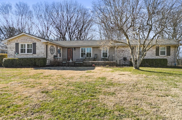 ranch-style home with a front yard