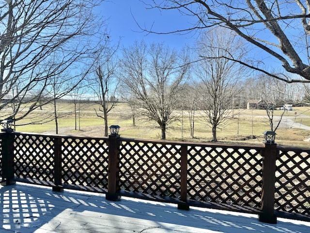 wooden terrace featuring a rural view