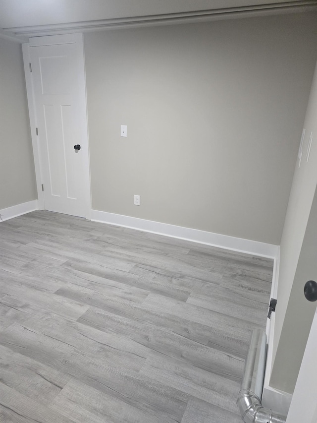 spare room featuring light hardwood / wood-style flooring