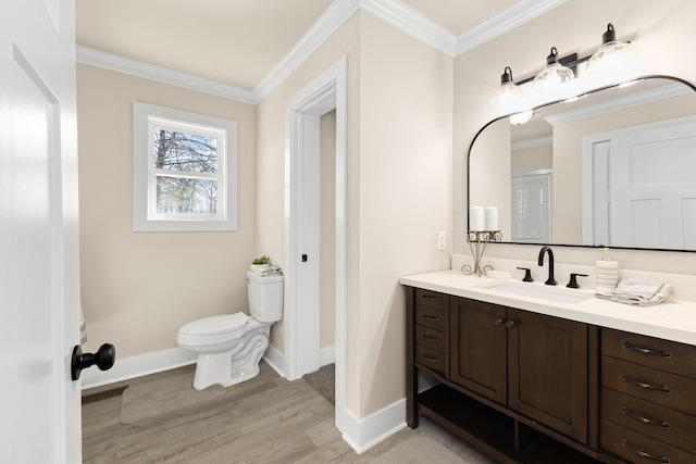 full bathroom with toilet, ornamental molding, wood finished floors, and vanity