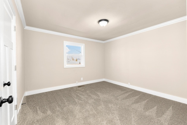 carpeted spare room featuring visible vents, baseboards, and crown molding