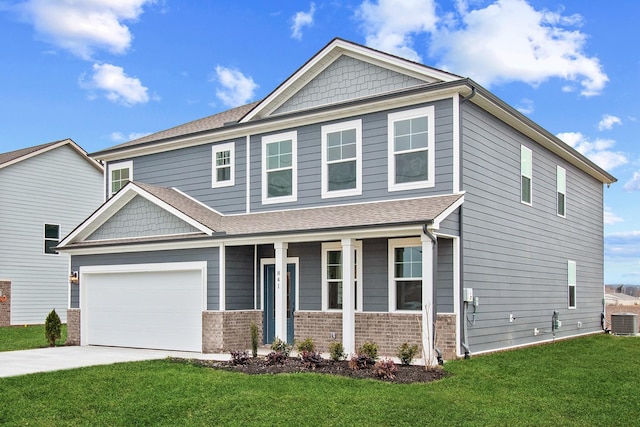 craftsman-style home featuring a garage, covered porch, a front yard, and central air condition unit