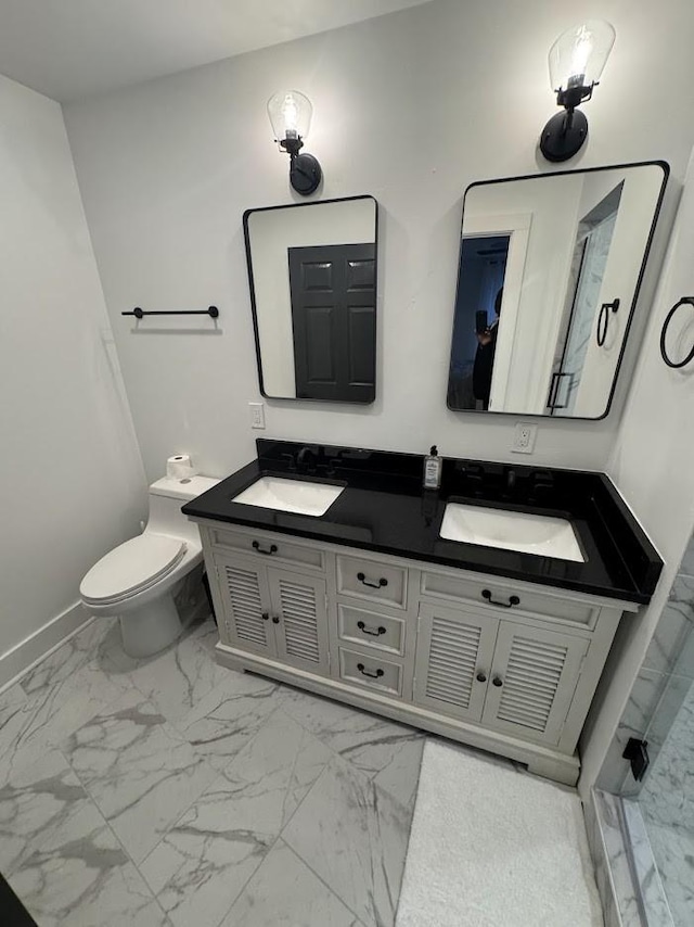 bathroom with toilet and vanity