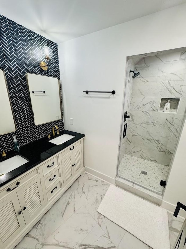 bathroom with vanity and a shower with door