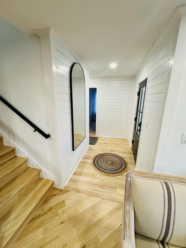 corridor with hardwood / wood-style floors