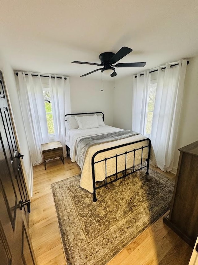 bedroom featuring ceiling fan and light hardwood / wood-style floors